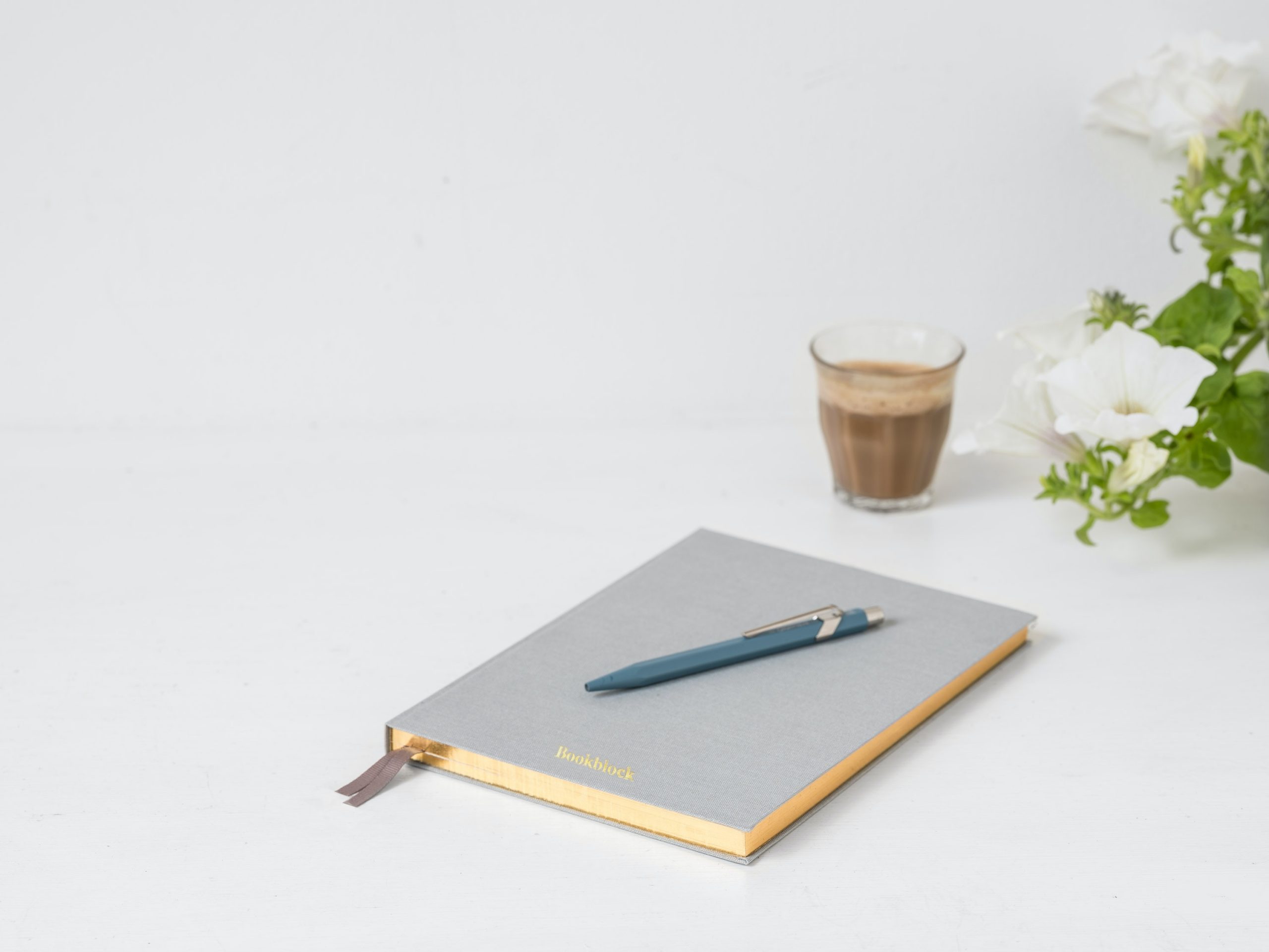 Notebook and pen to represent gratitude journaling and other mental exercises.