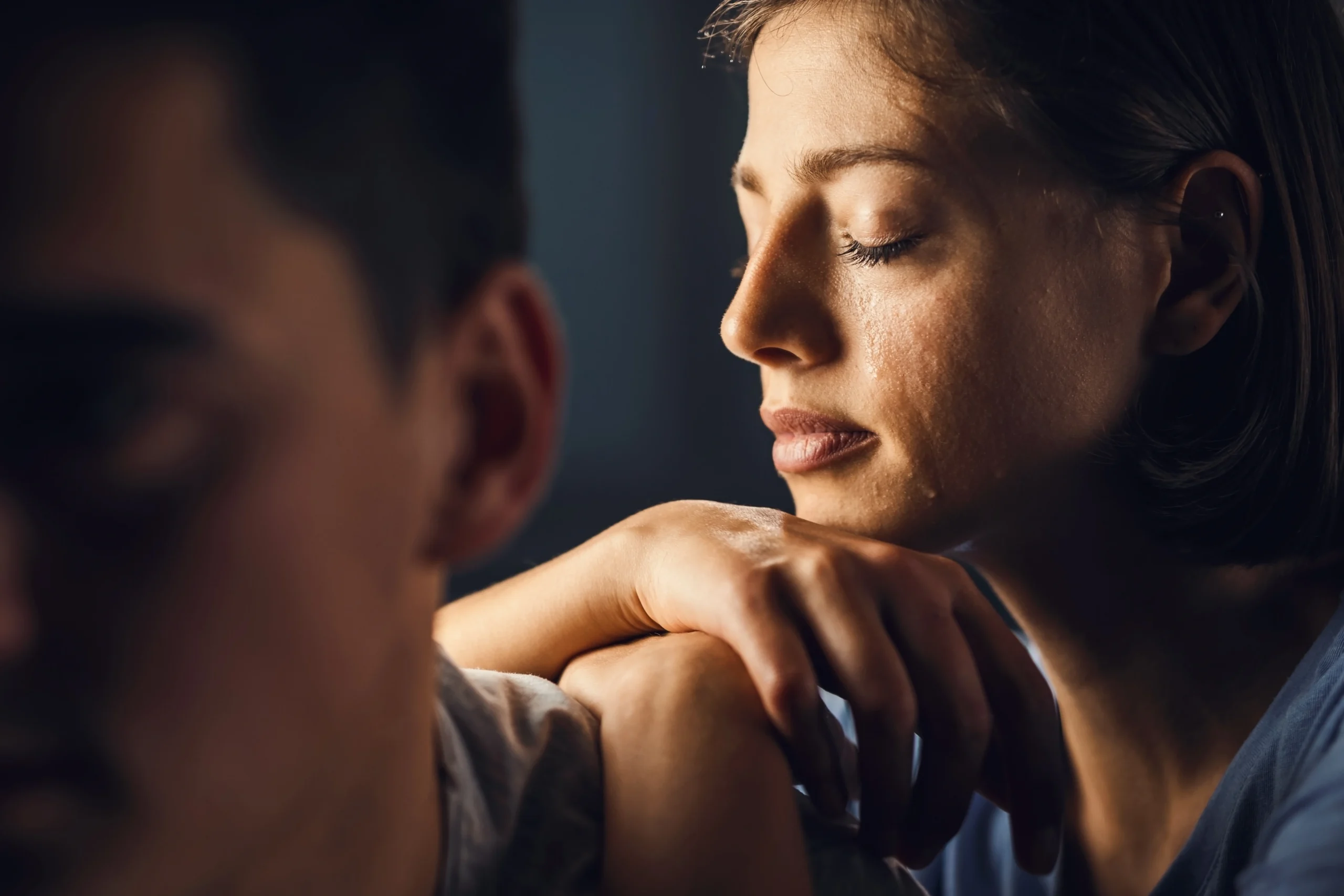 Woman receiving emotional support while experiencing distress
